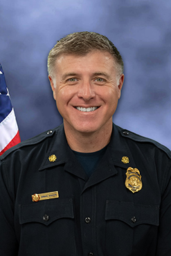 Aguiar Portrait in front of Flag