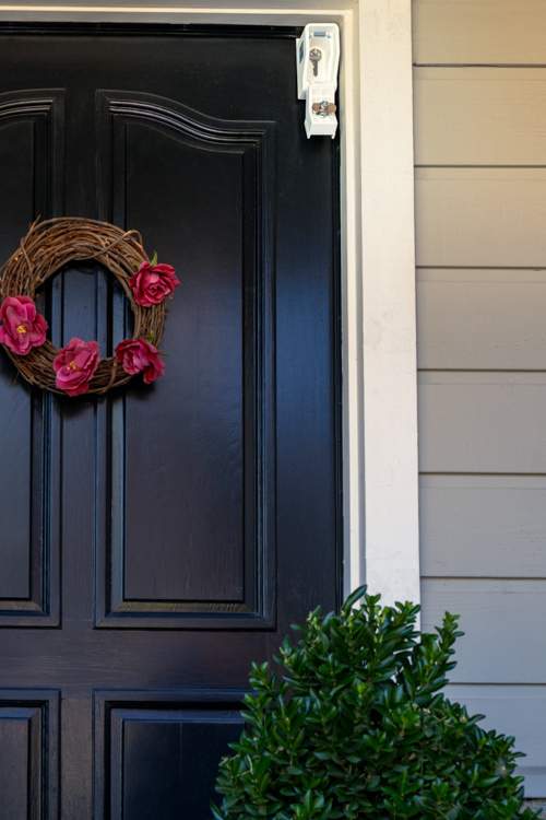 KnoxBox hangs on door with plant